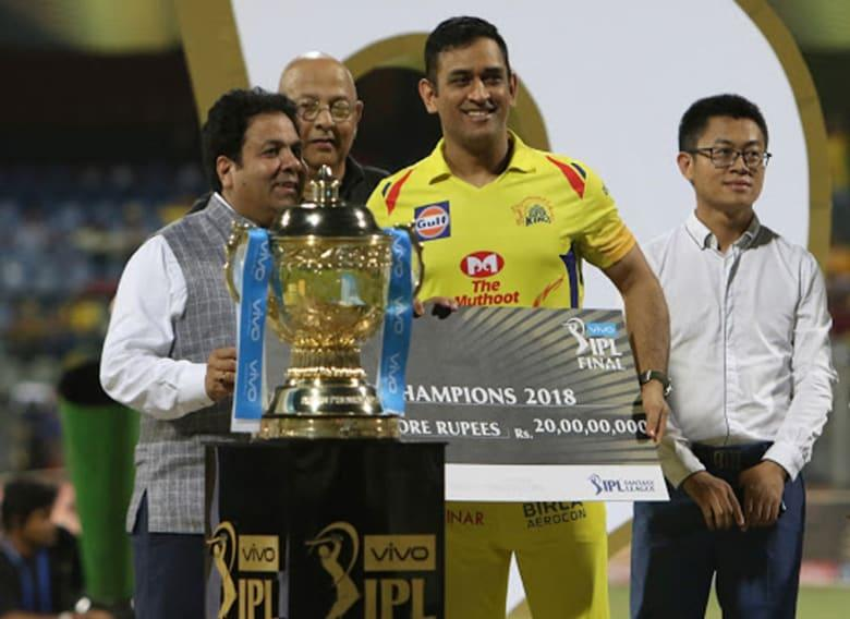 MS Dhoni receiving the 2018 IPL Trophy with CSK